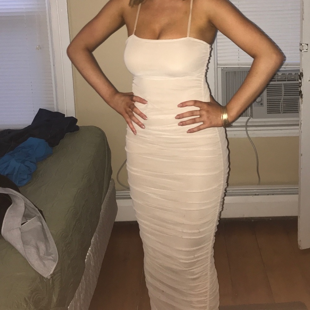 Fitted tan dress with mesh overlay